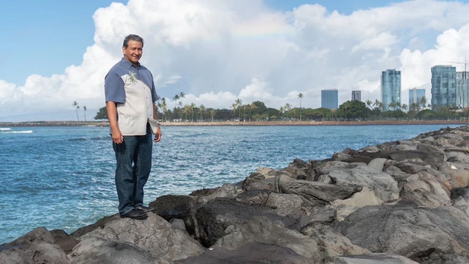 Al standing along the shoreline
